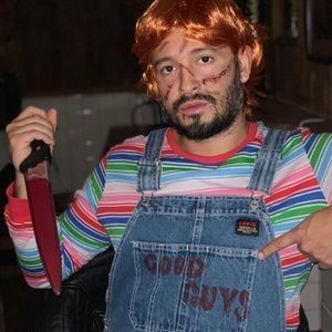 Chucky Overalls, knife, wig and suture tattoos. The shirt is not included.